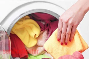 Holes in the clothes in the washing machine small